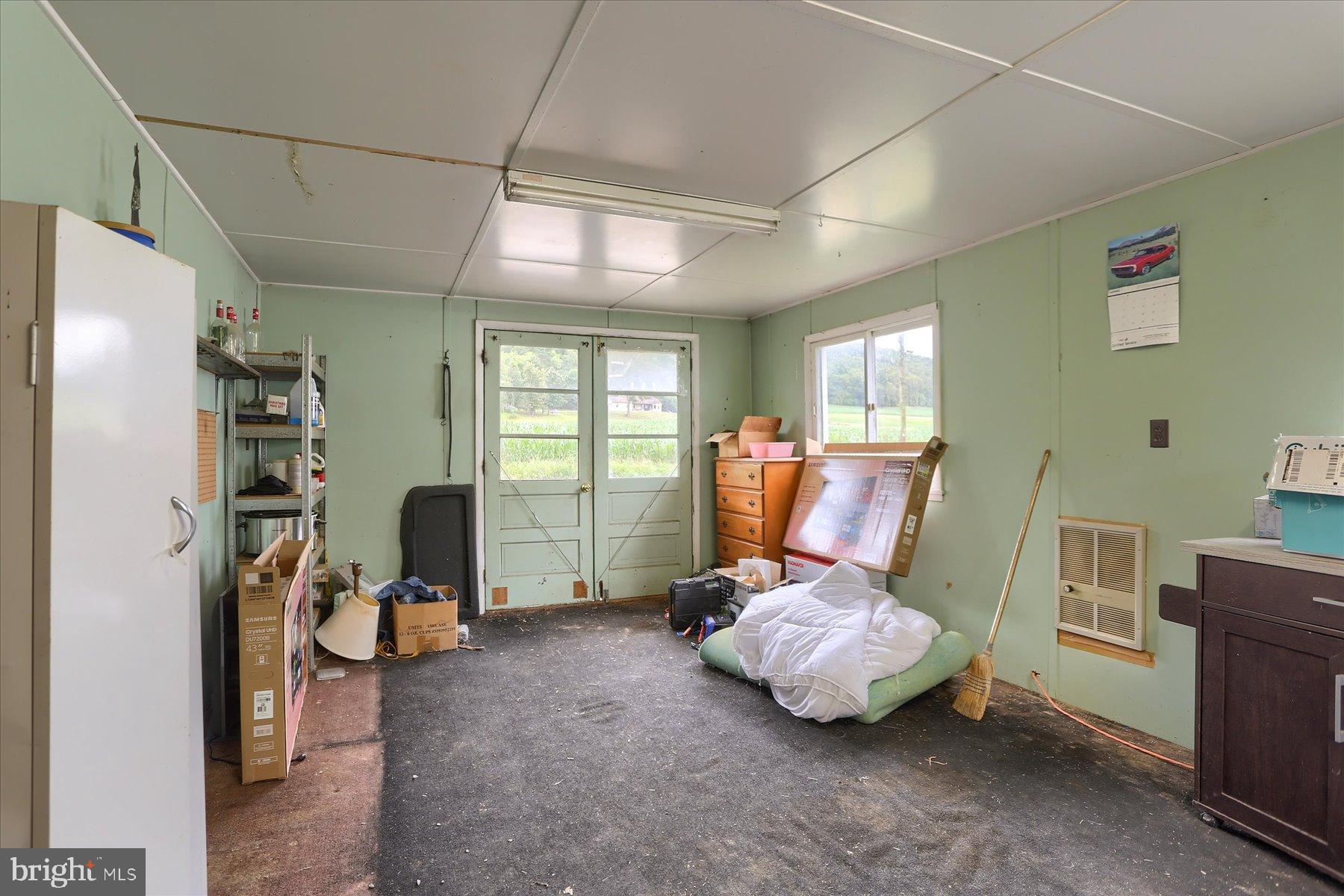 207 Mill Race Road Millerstown, PA 17062 - Photo 24 of 34 a room with furniture gym equipment and a window