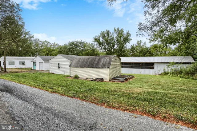 a view of backyard with barbeque grill and stairs