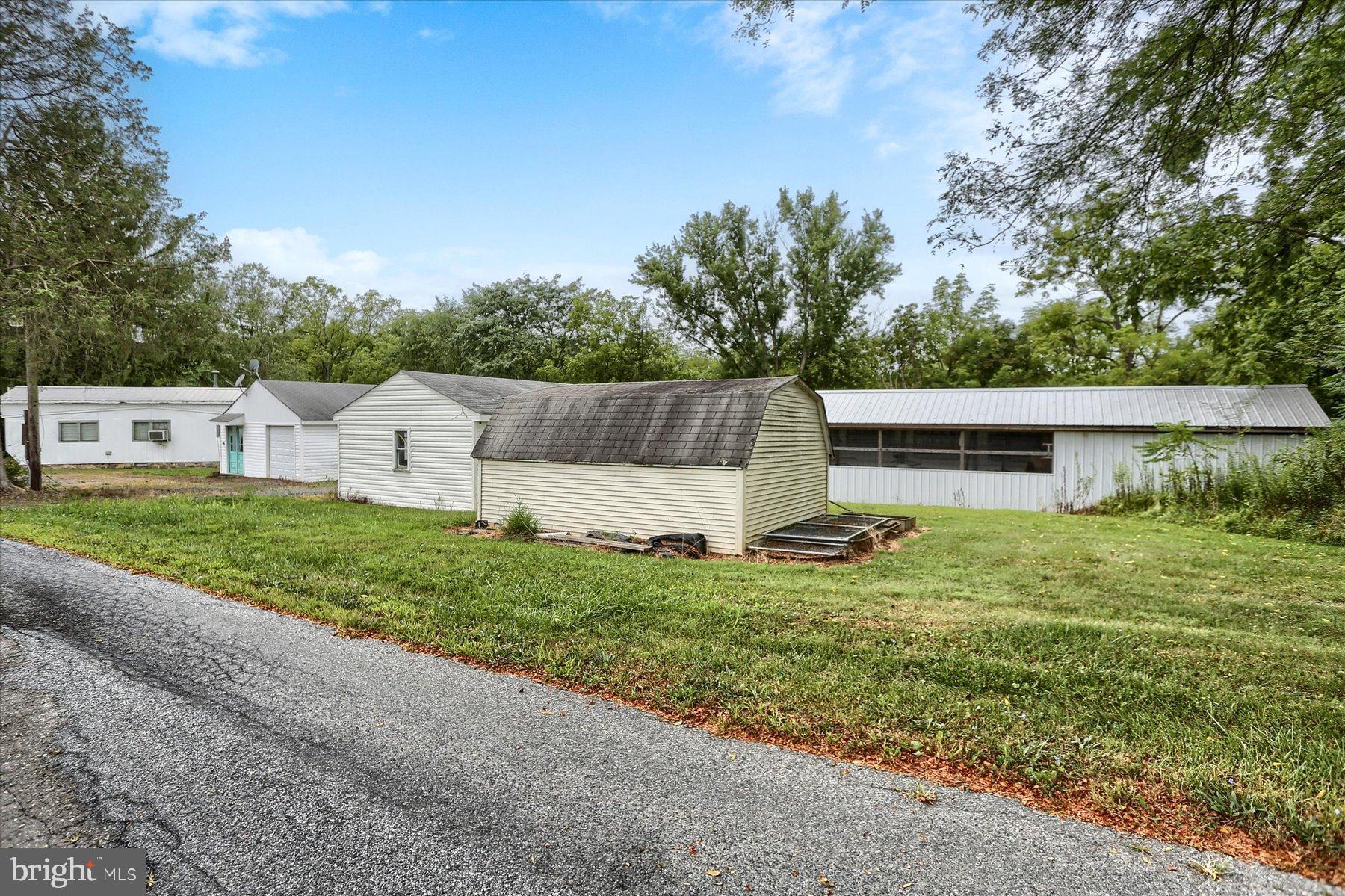 207 Mill Race Road Millerstown, PA 17062 - Photo 31 of 34 a view of backyard with barbeque grill and stairs