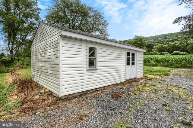 a view of a house with a yard and garage