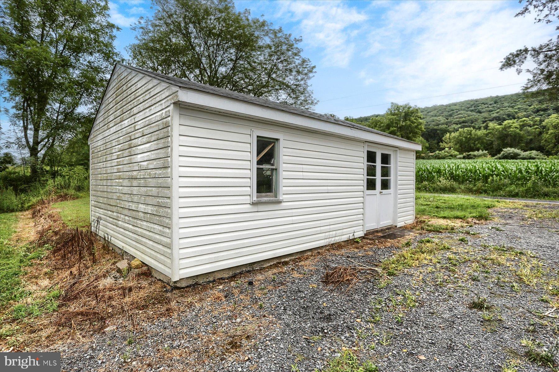 207 Mill Race Road Millerstown, PA 17062 - Photo 33 of 34 a view of a house with a yard and garage