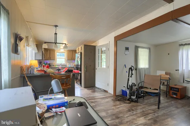 a room with furniture a rug and gym equipment