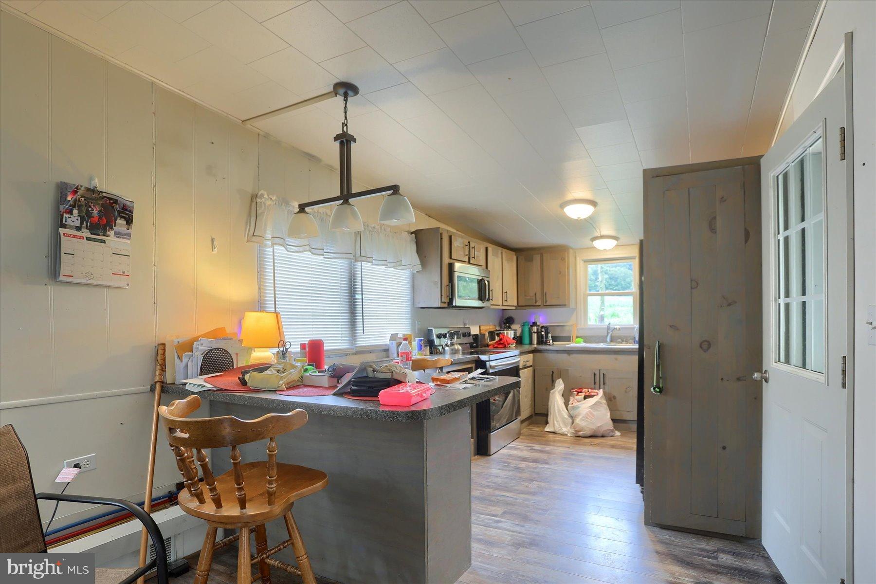 207 Mill Race Road Millerstown, PA 17062 - Photo 7 of 34 a kitchen with a table and chairs in it