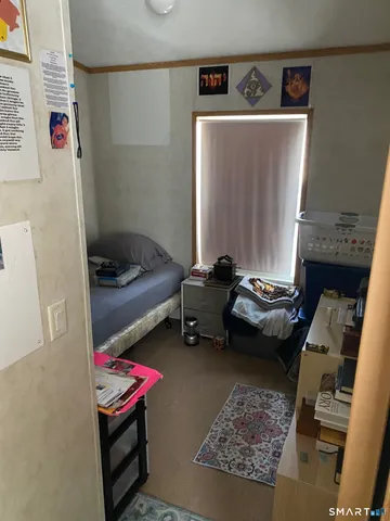 a bedroom with furniture and a couch