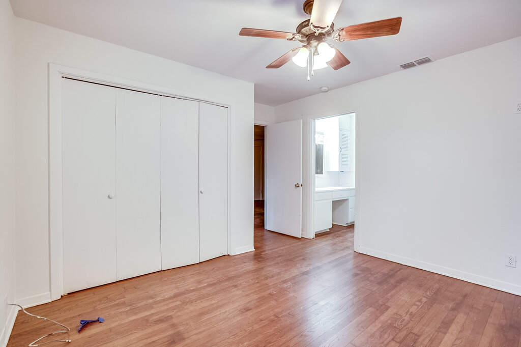 3707 Tom Green Street, Unit 2 Austin, TX 78705 - Photo 9 of 14 Unfurnished bedroom featuring light wood-style floors, ceiling fan, a closet, and ensuite bathroom