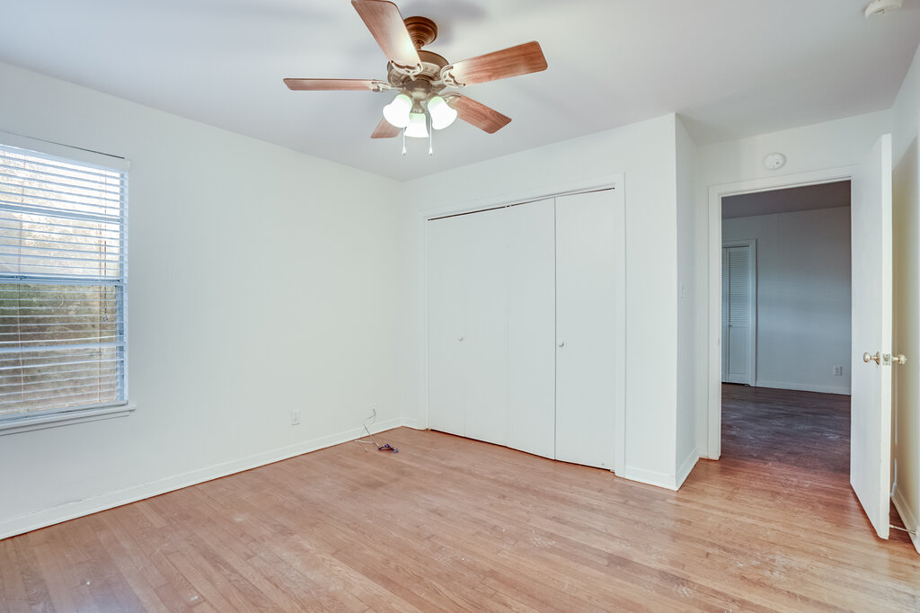 3707 Tom Green Street, Unit 2 Austin, TX 78705 - Photo 10 of 14 Unfurnished bedroom with light wood-style flooring, a closet, and a ceiling fan