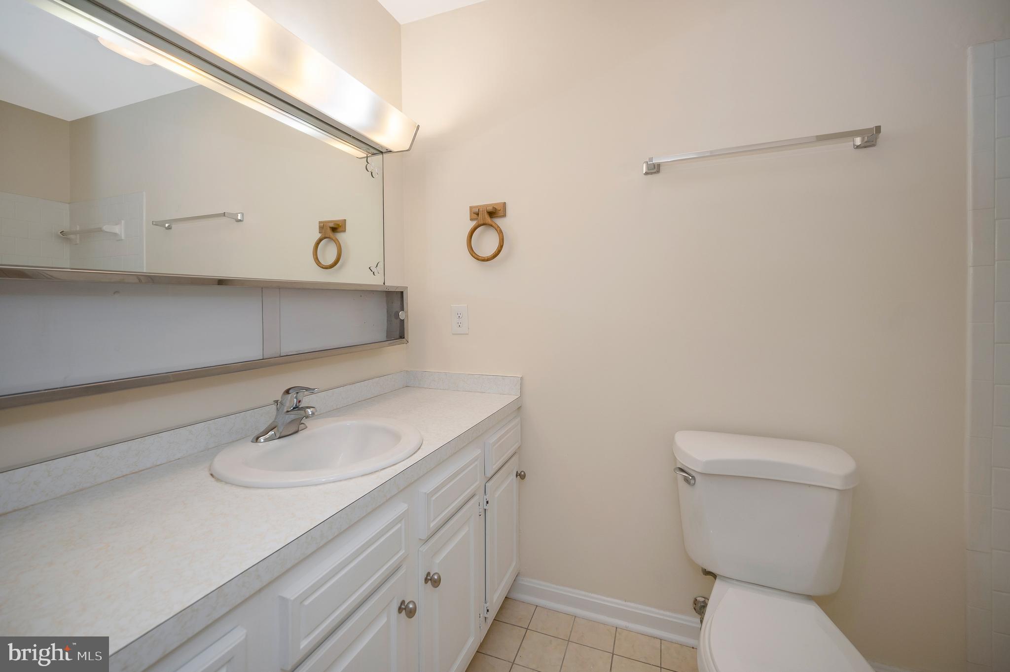 4 Randy Court Fredericksburg, VA 22407 - Photo 22 of 39 a bathroom with a sink toilet and vanity