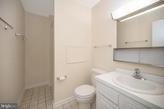 a bathroom with a sink toilet and vanity