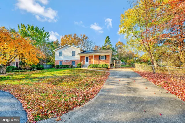 a view of house with outdoor space and sitting area