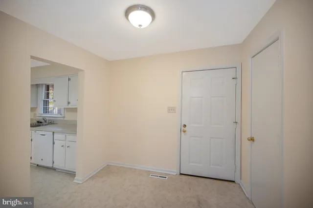 a bathroom with a granite countertop sink and mirror