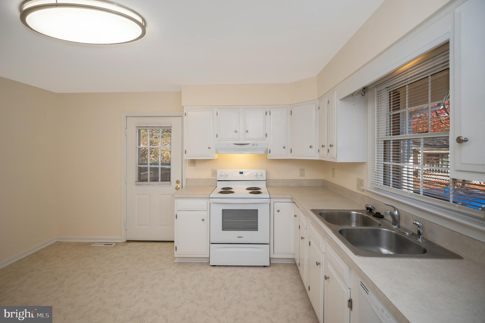 4 Randy Court Fredericksburg, VA 22407 - Photo 9 of 39 a kitchen with a sink stove and cabinets