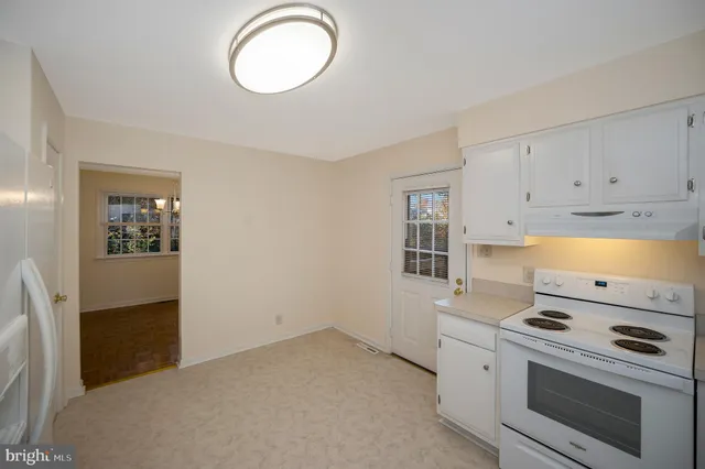 a kitchen with a stove and a microwave