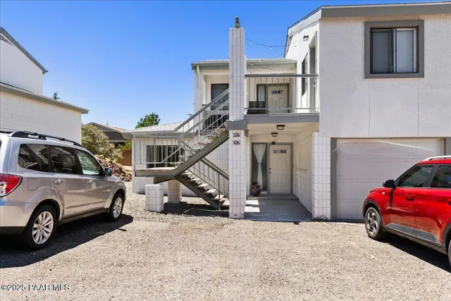 a view of a car in front of a house