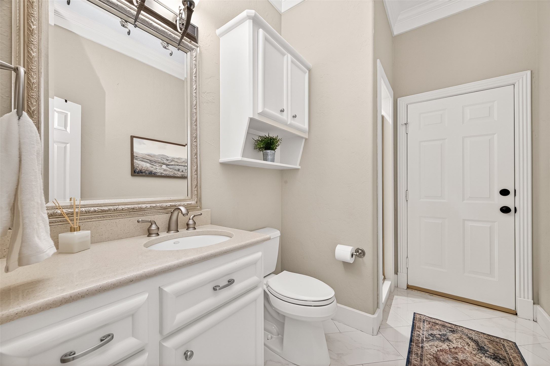 22 Stonegate Park Court Spring, TX 77379 - Photo 21 of 49 View of the 1st floor bathroom with walk-in shower and convenient access to the backyard.