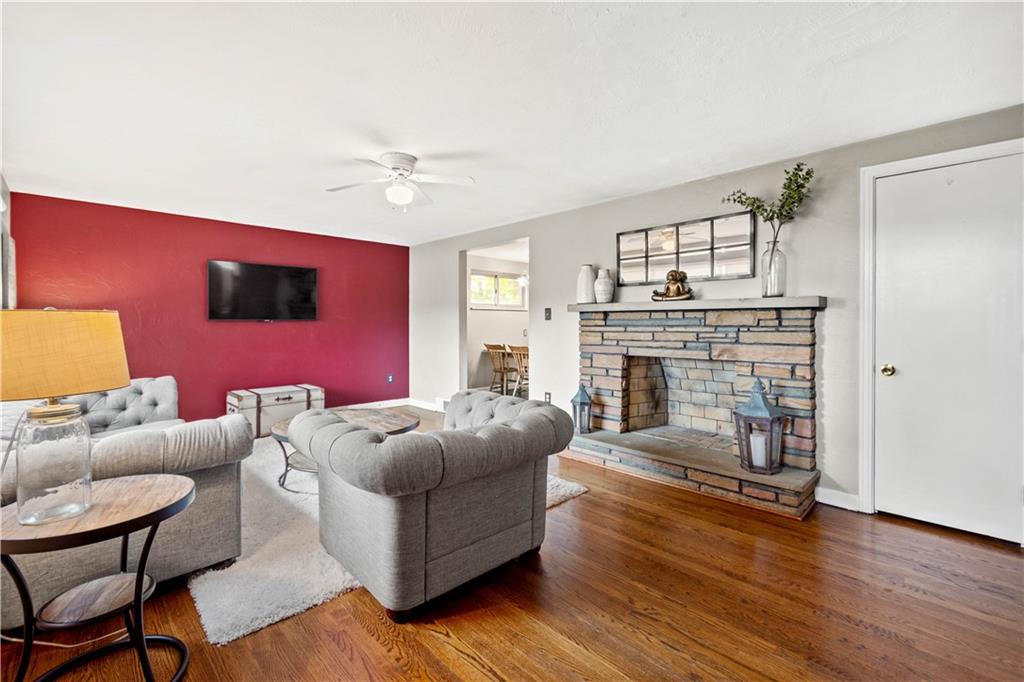 304 Rockfield Road Pittsburgh, PA 15243 - Photo 5 of 25 a living room with furniture and a fireplace
