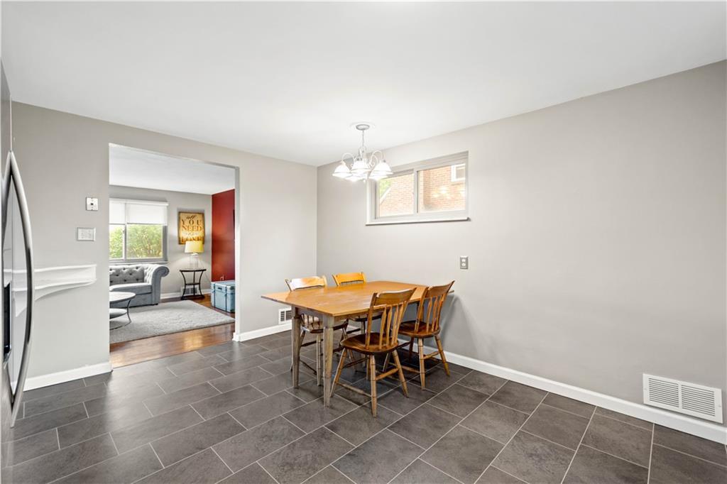 304 Rockfield Road Pittsburgh, PA 15243 - Photo 9 of 25 a view of a dining room with furniture and a chandelier