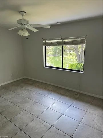 a bathroom with a granite countertop toilet sink and shower
