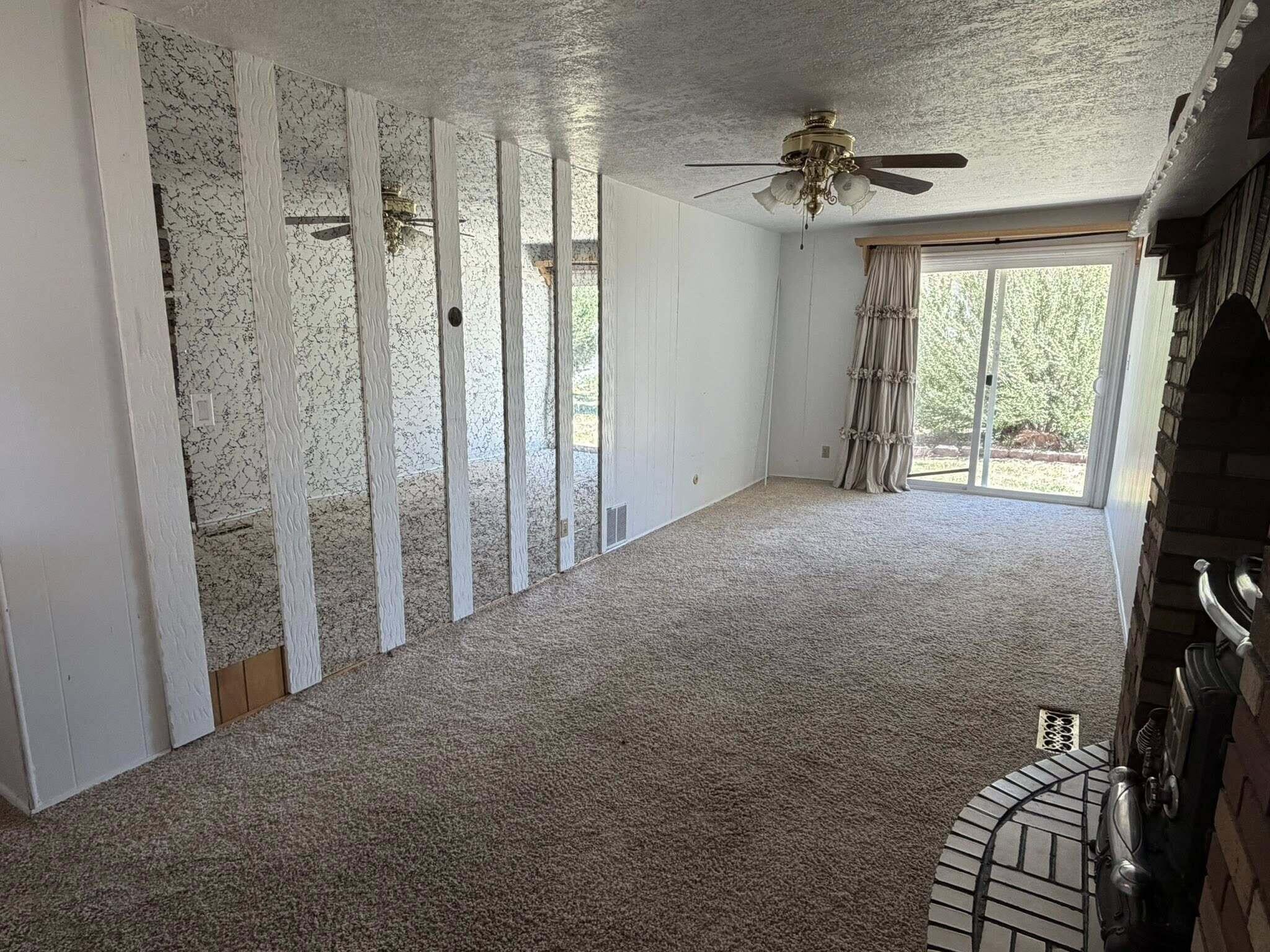 195 South 100 E Street Beaver, UT 84713 - Photo 9 of 23 Family Room with wood stove