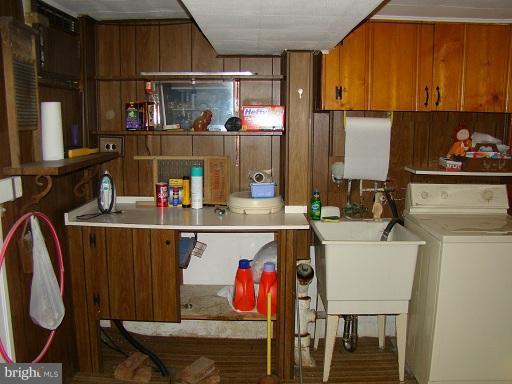 326 Dark Head Road Middle River, MD 21220 - Photo 11 of 22 a kitchen with a table chairs and a refrigerator