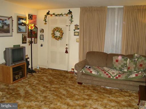 326 Dark Head Road Middle River, MD 21220 - Photo 4 of 22 a bedroom with a bed and a flat screen tv