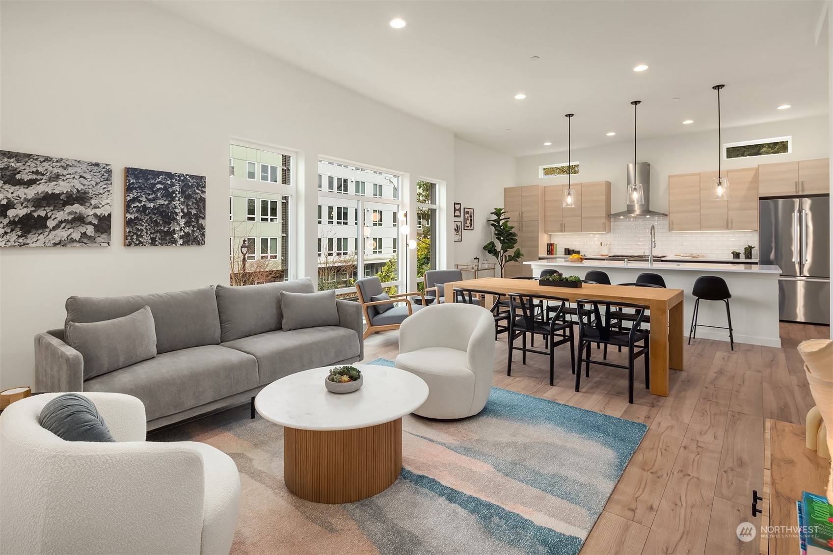 10322 Northeast 185th Street, Unit A Bothell, WA 98011 - Photo 1 of 22 a living room with furniture kitchen view and a large window