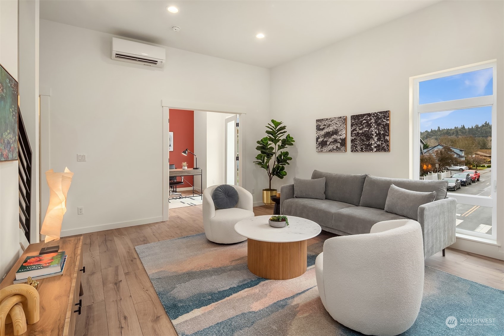 10322 Northeast 185th Street, Unit A Bothell, WA 98011 - Photo 11 of 22 a living room with furniture a rug and a large window