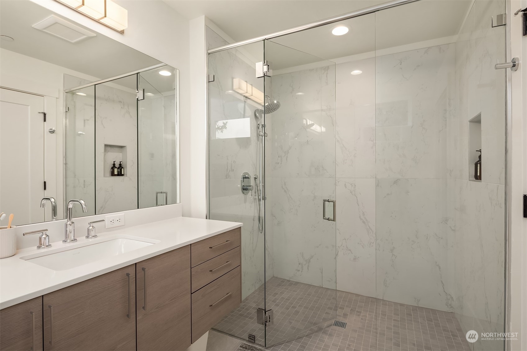 10322 Northeast 185th Street, Unit A Bothell, WA 98011 - Photo 18 of 22 a bathroom with a shower sink vanity granite and shower