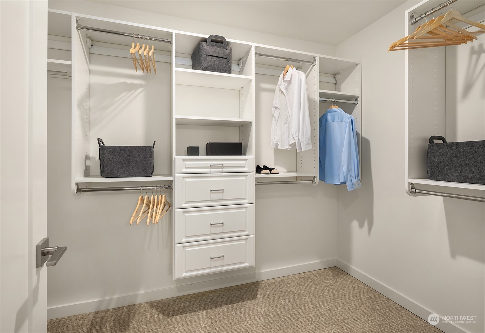 10322 Northeast 185th Street, Unit A Bothell, WA 98011 - Photo 19 of 22 a view of walk in closet with clothes and shoes