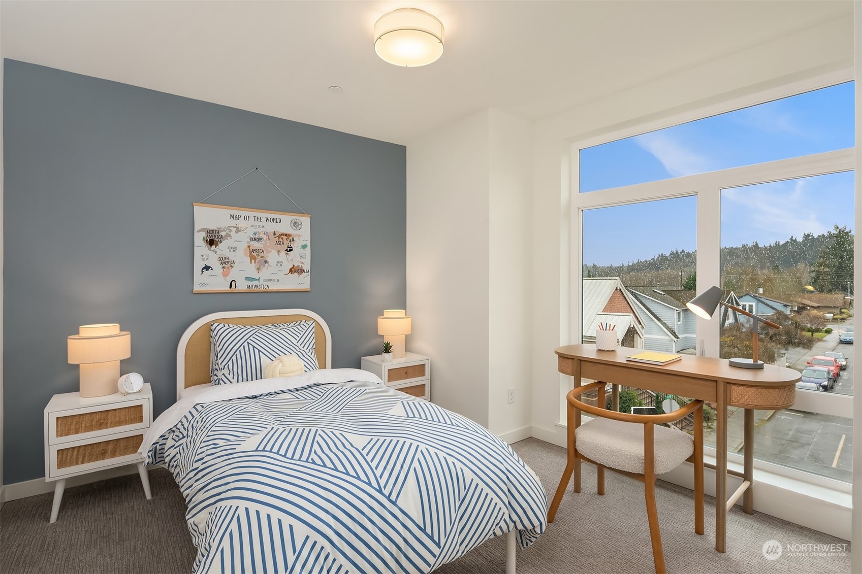 10322 Northeast 185th Street, Unit A Bothell, WA 98011 - Photo 20 of 22 a bedroom with a bed and wooden floor
