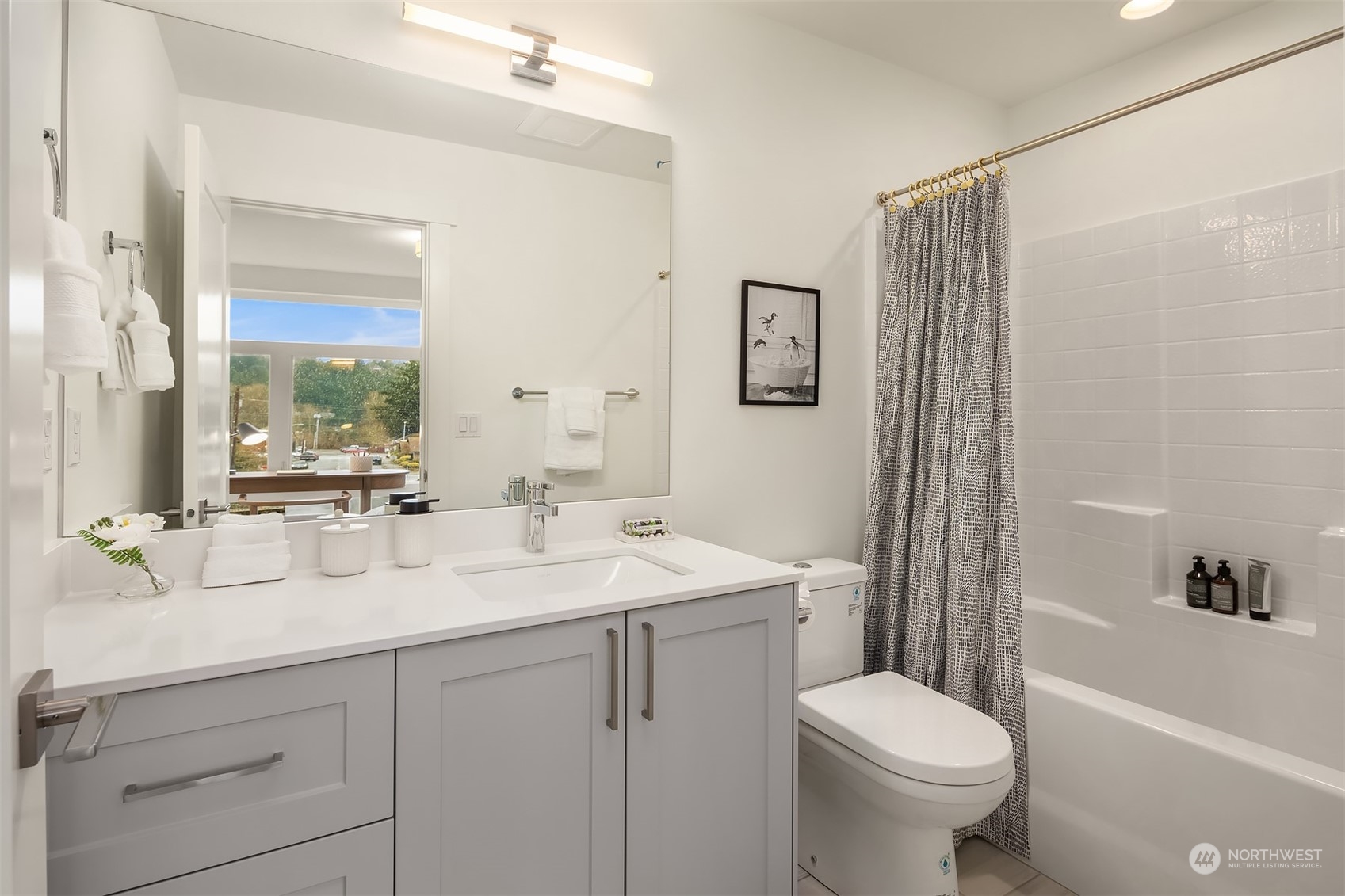 10322 Northeast 185th Street, Unit A Bothell, WA 98011 - Photo 22 of 22 a bathroom with a sink toilet and shower