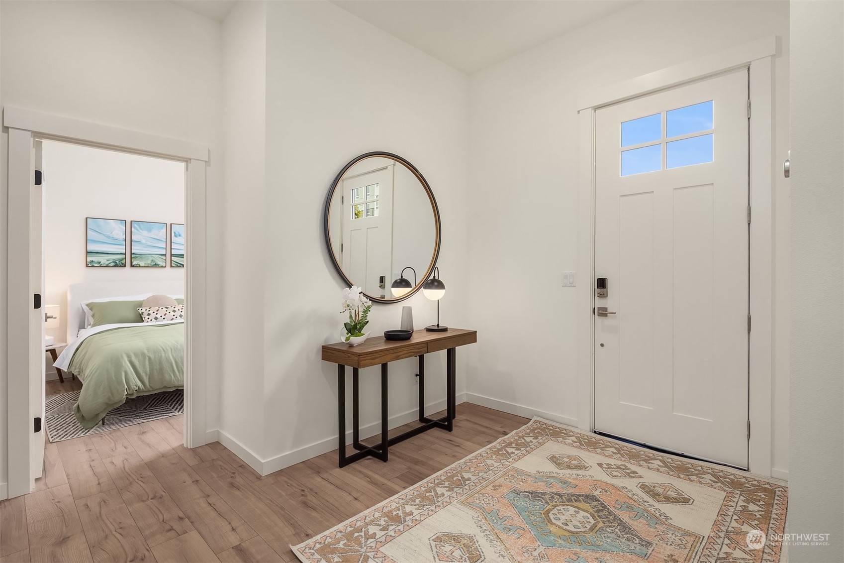10322 Northeast 185th Street, Unit A Bothell, WA 98011 - Photo 3 of 22 a bedroom with a bed and a mirror