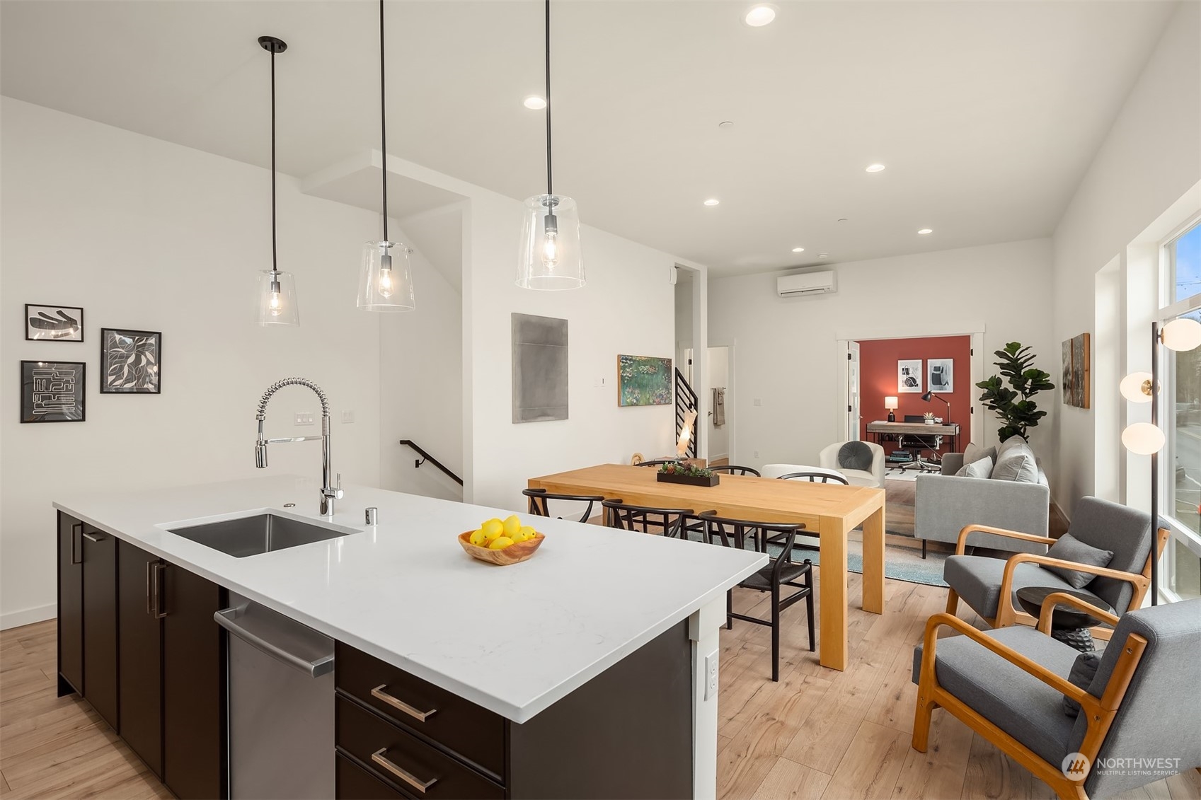 10322 Northeast 185th Street, Unit A Bothell, WA 98011 - Photo 6 of 22 a view of kitchen island a sink a table and chairs