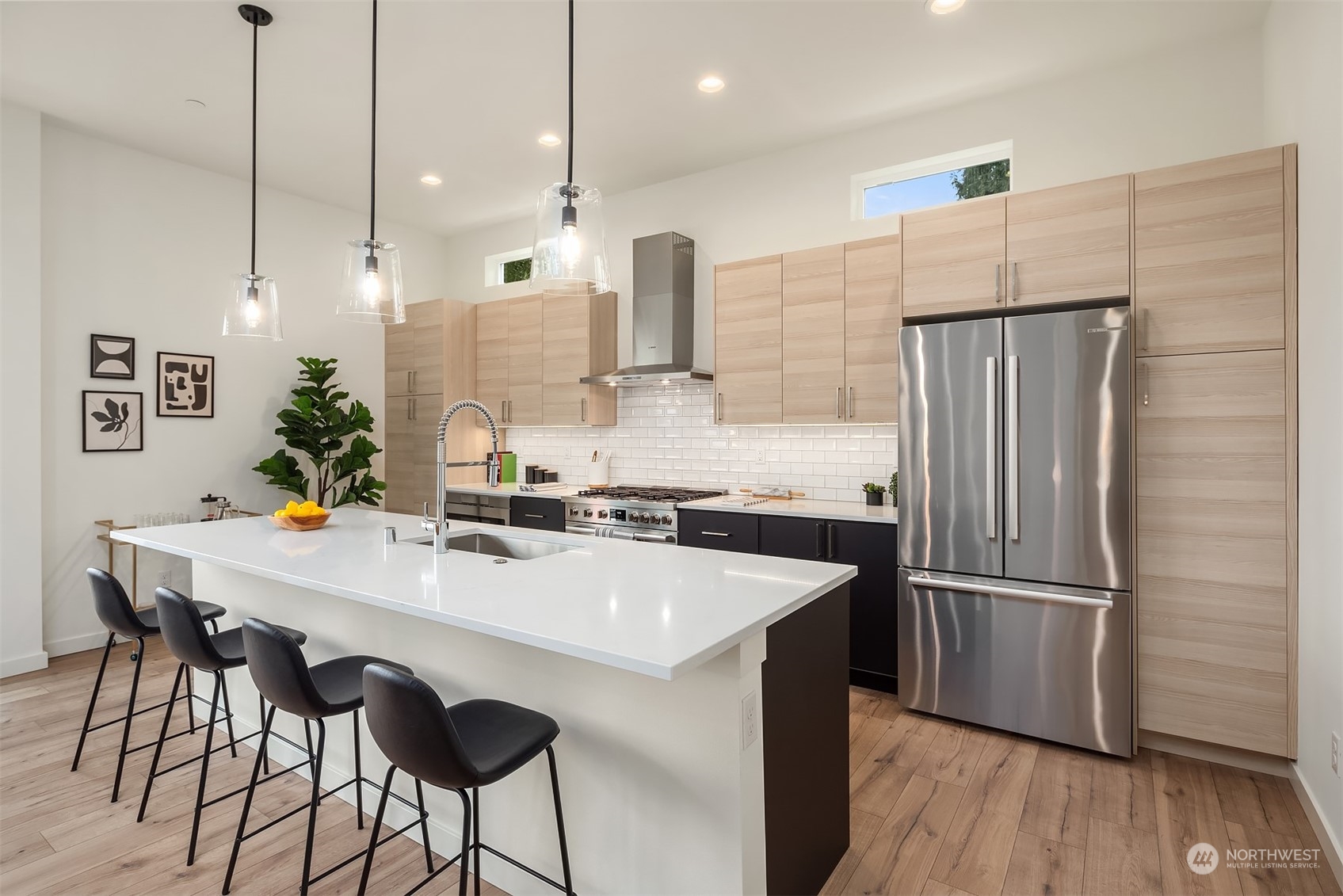 10322 Northeast 185th Street, Unit A Bothell, WA 98011 - Photo 8 of 22 a kitchen with stainless steel appliances granite countertop a refrigerator a sink and a stove