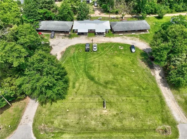 a view of a yard and a house