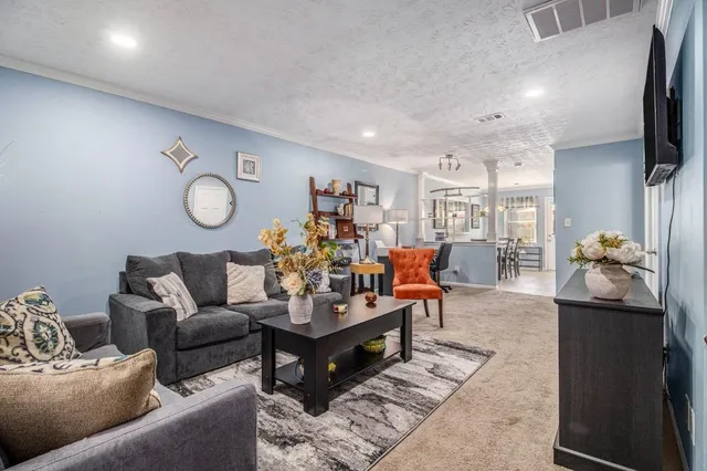 a view of a dining room with furniture and window