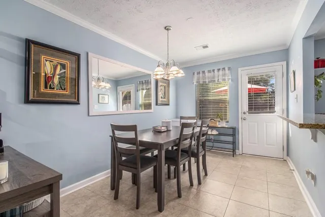 a kitchen with a table and chairs in it