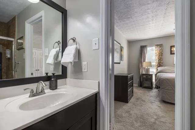 an empty room with a view of a hallway