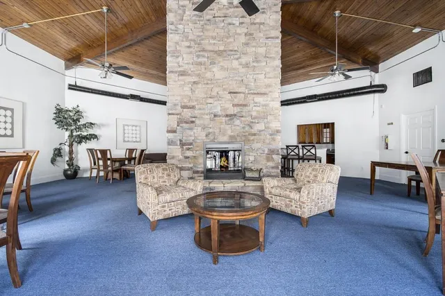 a view of a brick building next to a yard