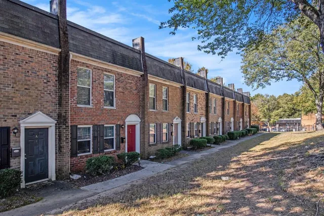 a picture of a bench in front of a wall