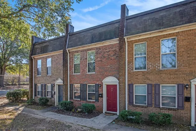 a front view of a house with yard