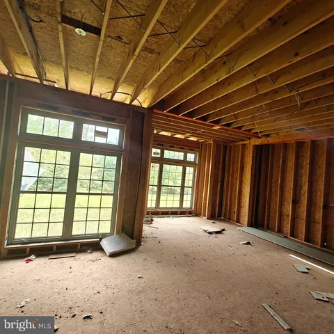 a view of an empty room with a balcony