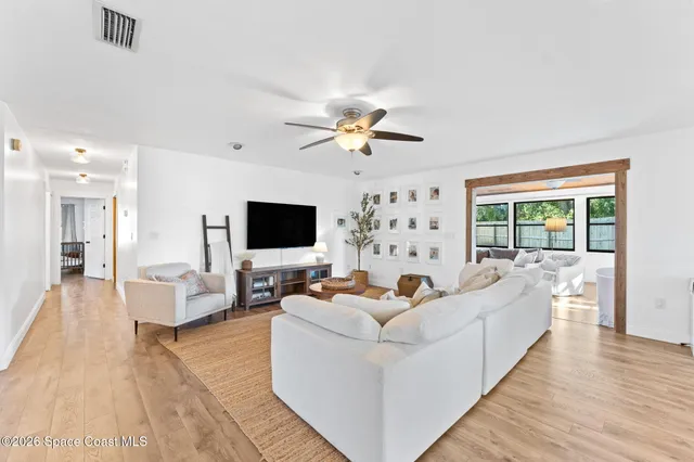 a living room with furniture fireplace and a flat screen tv