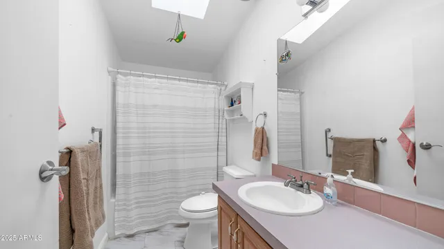 a bedroom with a bed and a table