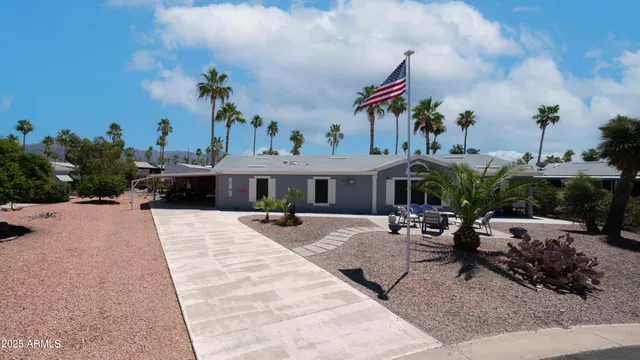 a view of a house with sitting area and entertaining space