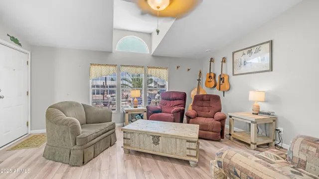 a living room with furniture and a large window