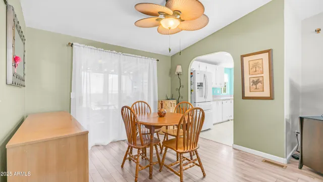 a dining room with furniture and window