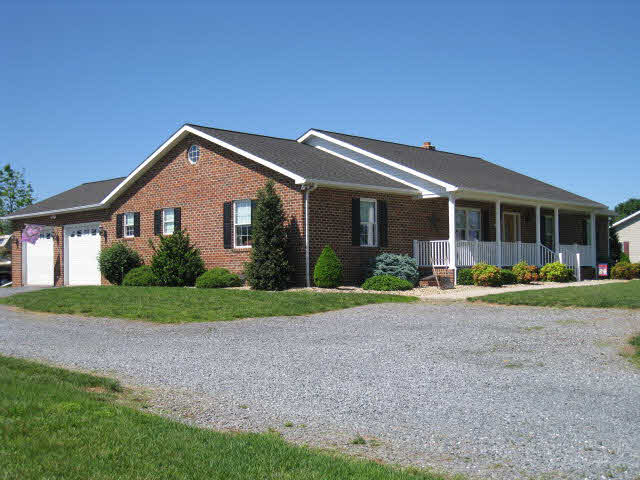 2252 Kerns Road Dayton, VA 22821 - Photo 1 of 31 a front view of a house with garden