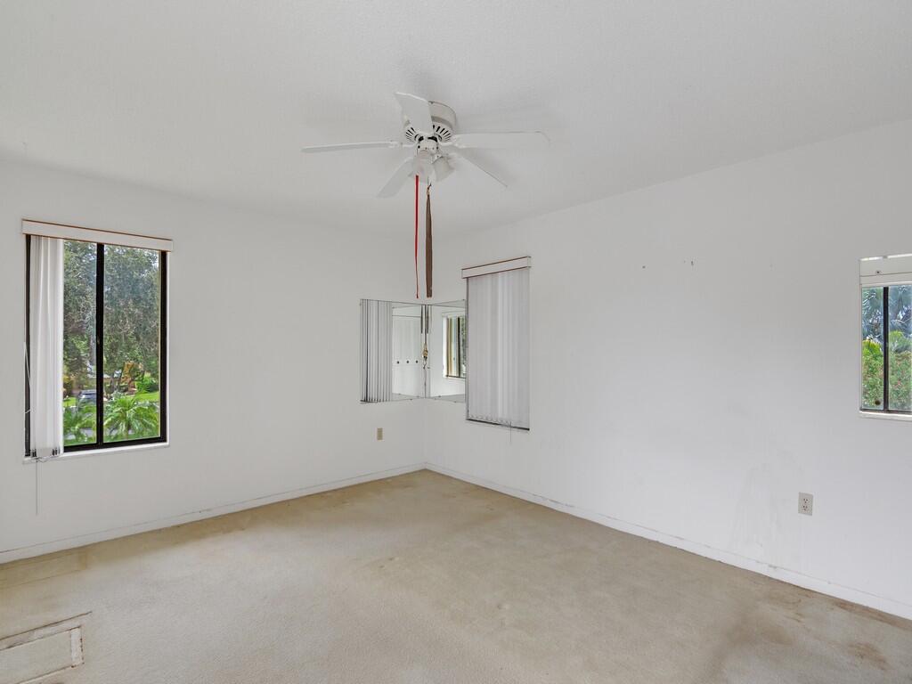 5373 Southeast Miles Grant Road, Unit 208 Stuart, FL 34997 - Photo 18 of 32 a view of an empty room with a window