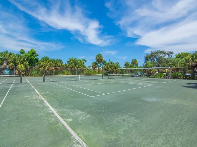 a view of an outdoor space and tennis court