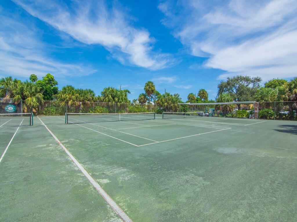 5373 Southeast Miles Grant Road, Unit 208 Stuart, FL 34997 - Photo 31 of 32 a view of a tennis court